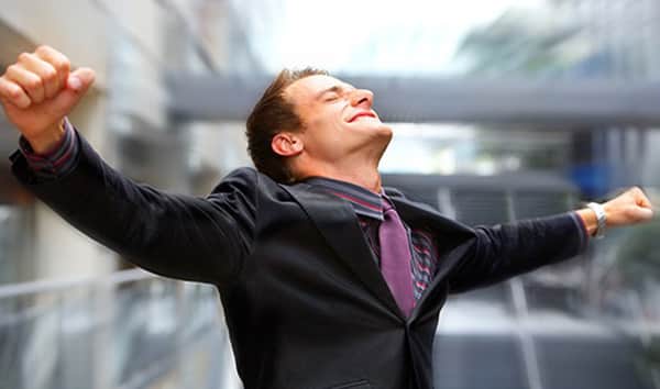 Happy sales recruit with arms outstretched 